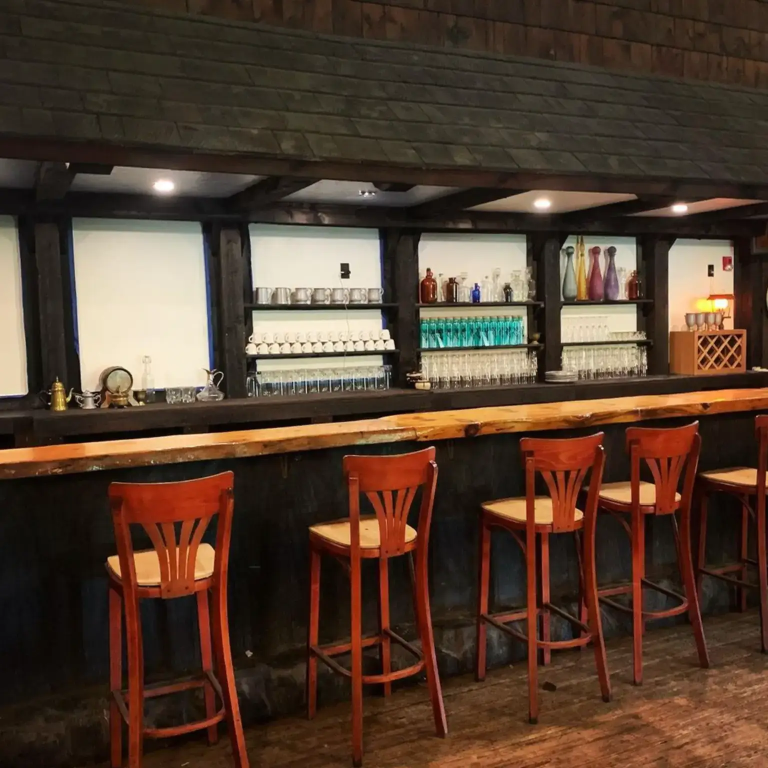 Rustic event venue in Charlton Massachusetts with a full tavern, bar, cabins, expansive forest, hiking trails, and beautiful natural surroundings at Ye Olde Commons